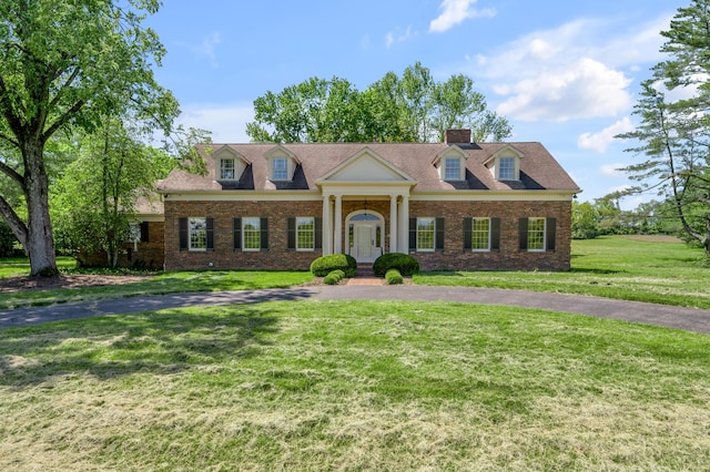 1373 Delong Cir, Lexington, KY 40515 - view of front of property with a front yard, a chimney, and brick siding