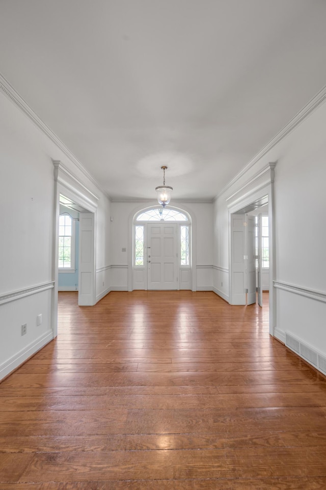 1373 Delong Cir, Lexington, KY 40515 - entrance foyer with hardwood / wood-style floors, crown molding, and a chandelier
