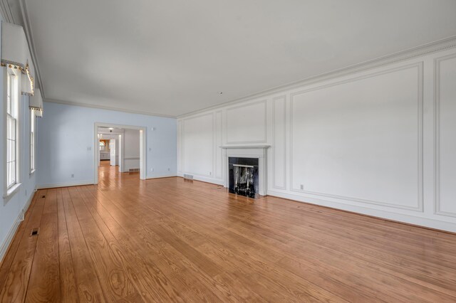 1373 Delong Cir, Lexington, KY 40515 - unfurnished living room featuring a decorative wall, crown molding, a high end fireplace, and light wood finished floors