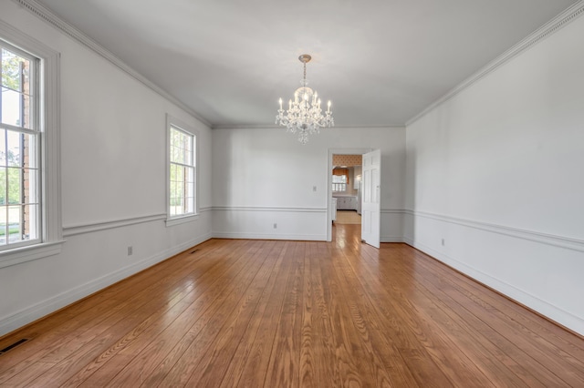 1373 Delong Cir, Lexington, KY 40515 - empty room with a chandelier, hardwood / wood-style floors, ornamental molding, and baseboards