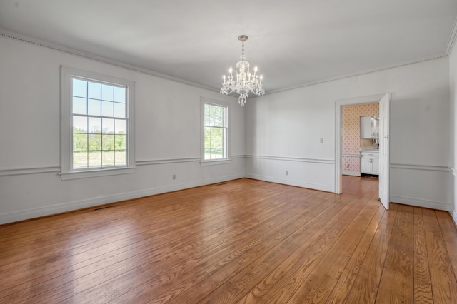 1373 Delong Cir, Lexington, KY 40515 - unfurnished dining area featuring light wood-type flooring, a chandelier, ornamental molding, and baseboards
