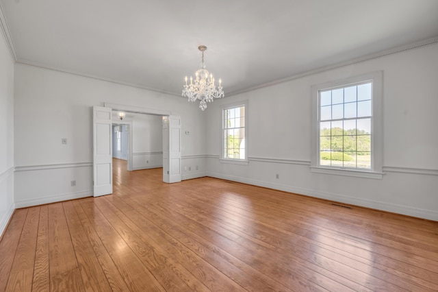 1373 Delong Cir, Lexington, KY 40515 - unfurnished room with light wood-type flooring, a chandelier, baseboards, and crown molding
