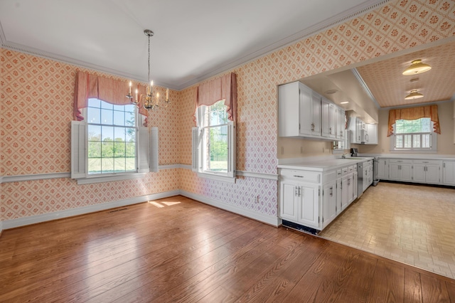 1373 Delong Cir, Lexington, KY 40515 - kitchen featuring wallpapered walls, crown molding, light countertops, a chandelier, and baseboards