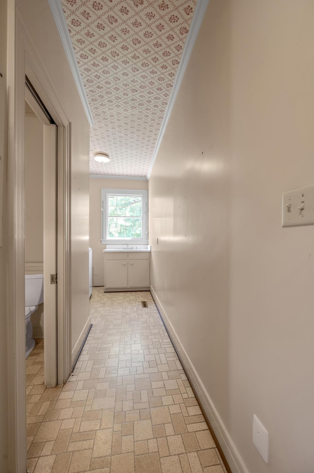 1373 Delong Cir, Lexington, KY 40515 - corridor featuring baseboards, ornamental molding, and brick patterned flooring