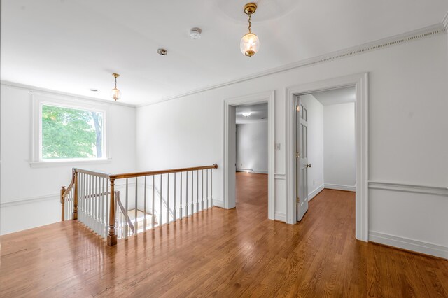 1373 Delong Cir, Lexington, KY 40515 - hall featuring an upstairs landing, wood finished floors, and baseboards