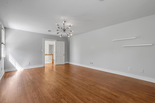 1373 Delong Cir, Lexington, KY 40515 - spare room with a chandelier, wood finished floors, and baseboards