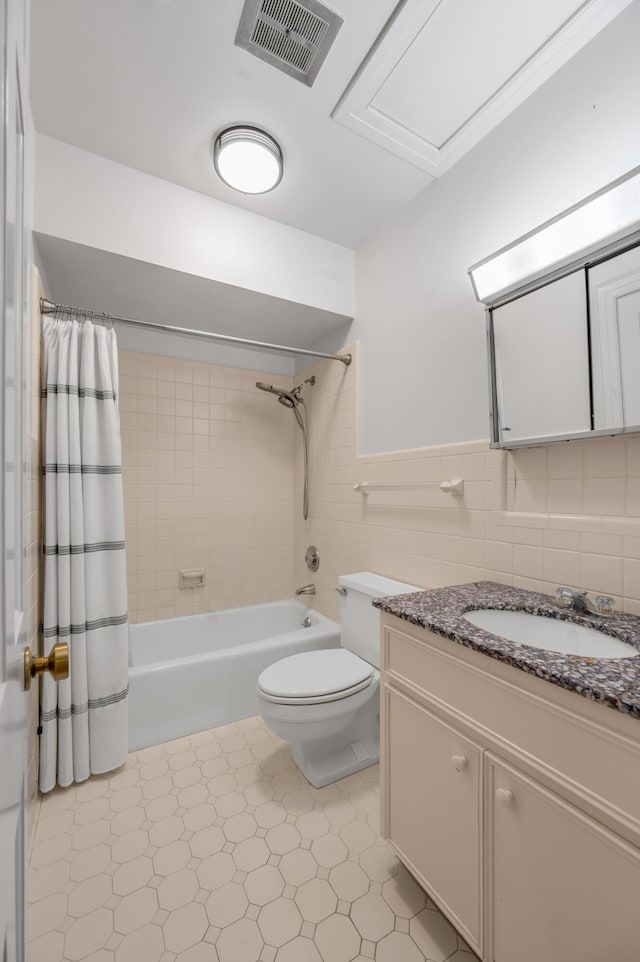 1373 Delong Cir, Lexington, KY 40515 - bathroom featuring shower / tub combo, toilet, vanity, tile patterned floors, and tile walls