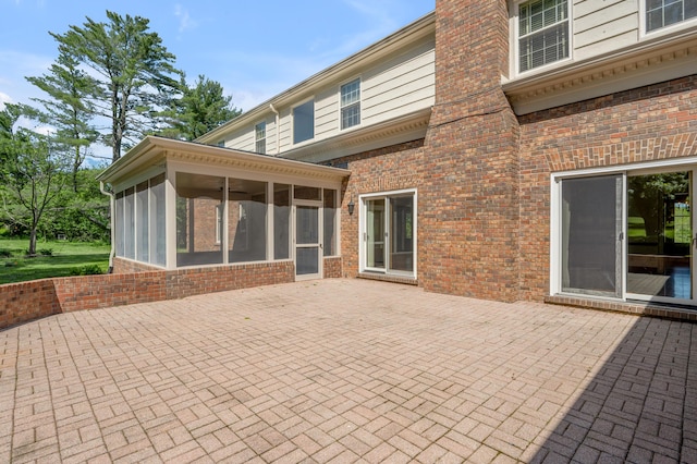 1373 Delong Cir, Lexington, KY 40515 - rear view of property with a patio, a sunroom, and brick siding