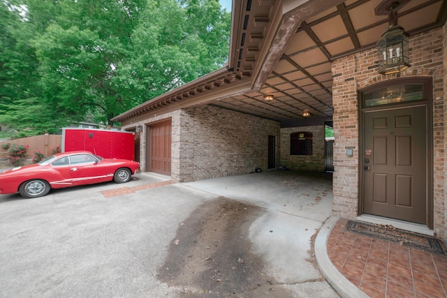 319 Fifth St, Paintsville, KY 41240 - view of side of home with concrete driveway, brick siding, and a carport