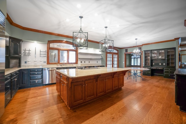 319 Fifth St, Paintsville, KY 41240 - kitchen with stainless steel dishwasher, a chandelier, ornamental molding, a sink, and light wood-style flooring
