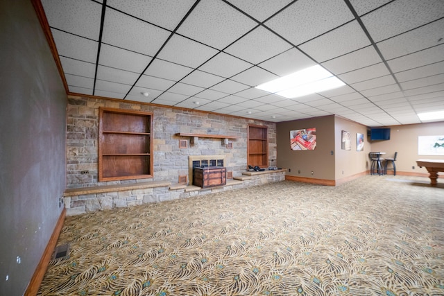 319 Fifth St, Paintsville, KY 41240 - finished below grade area with carpet, baseboards, built in features, a fireplace, and a paneled ceiling