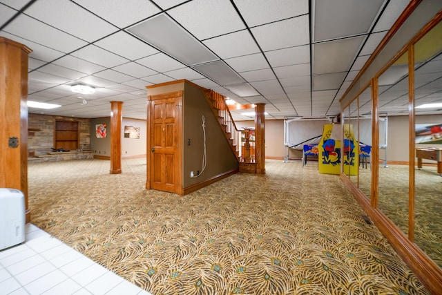 319 Fifth St, Paintsville, KY 41240 - finished basement featuring carpet flooring, stairs, a paneled ceiling, and baseboards
