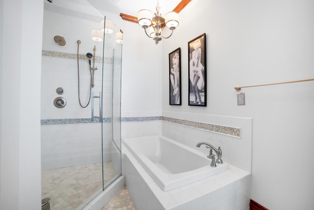 319 Fifth St, Paintsville, KY 41240 - bathroom with a stall shower, a garden tub, and a chandelier