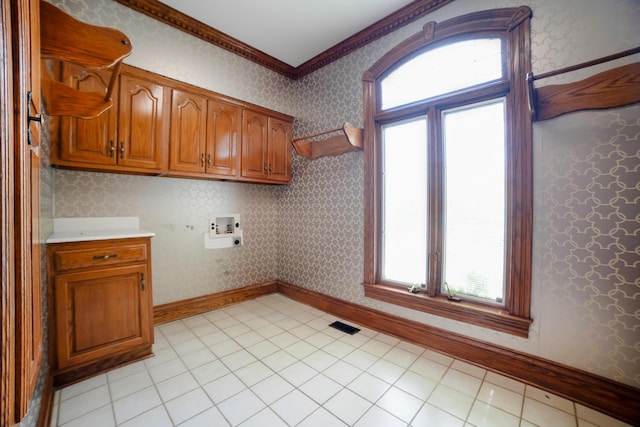 319 Fifth St, Paintsville, KY 41240 - washroom featuring ornamental molding, cabinet space, washer hookup, light tile patterned floors, and wallpapered walls
