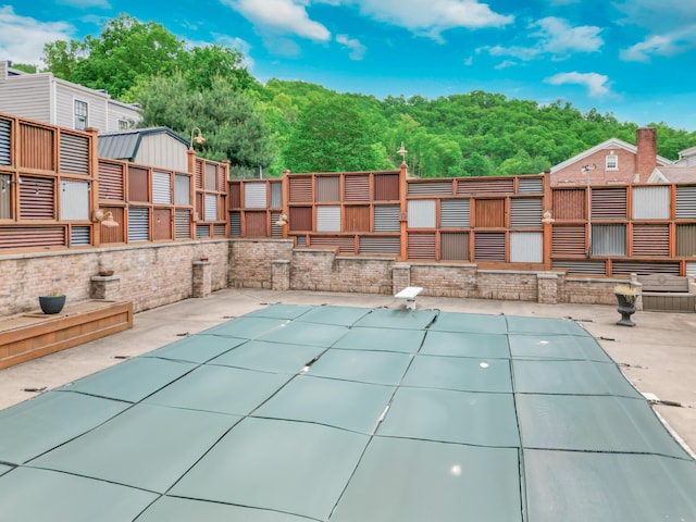 319 Fifth St, Paintsville, KY 41240 - view of swimming pool with a diving board, a covered pool, and a patio