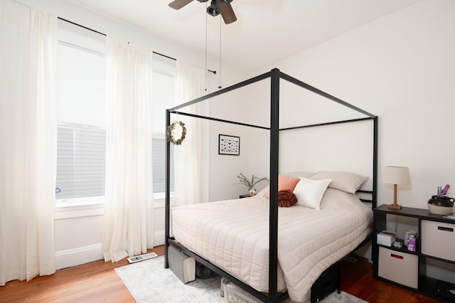 647 N Limestone, Lexington, KY 40508 - bedroom with wood finished floors, baseboards, and ceiling fan