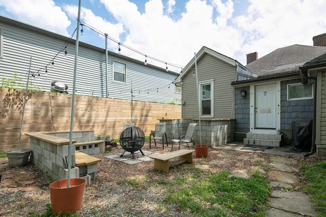 647 N Limestone, Lexington, KY 40508 - rear view of property featuring fence and an outdoor fire pit