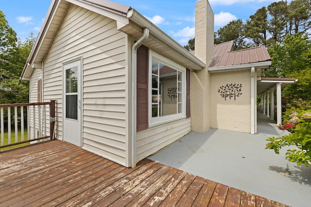 3131 Lily Rd, London, KY 40744 - view of side of property with a chimney, a wooden deck, and metal roof