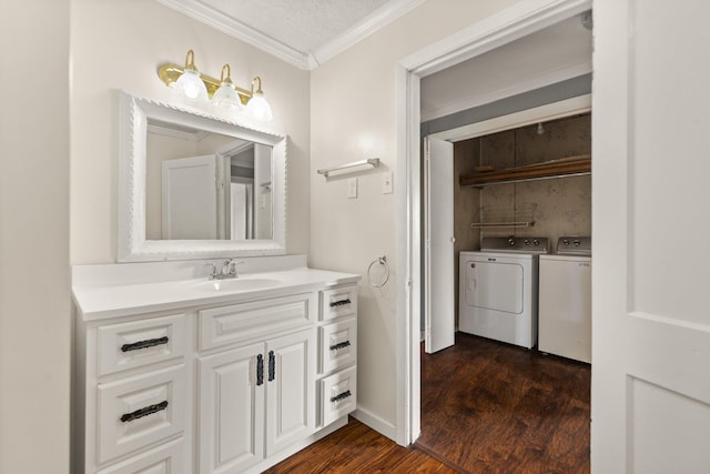 3131 Lily Rd, London, KY 40744 - bathroom with ornamental molding, independent washer and dryer, wood finished floors, vanity, and baseboards