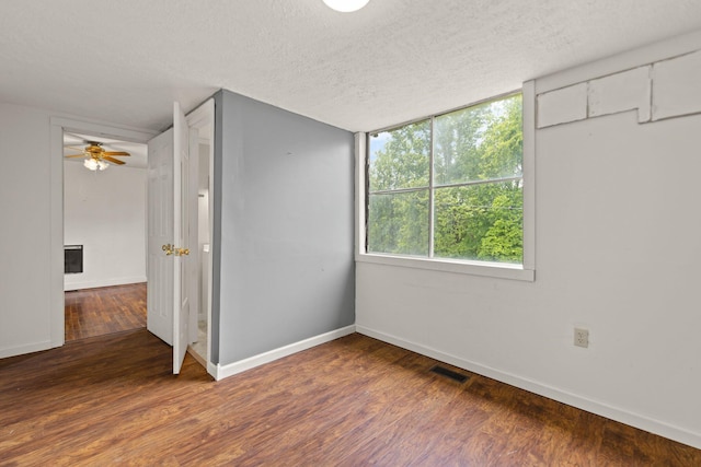 3131 Lily Rd, London, KY 40744 - unfurnished bedroom with wood finished floors, baseboards, and a textured ceiling