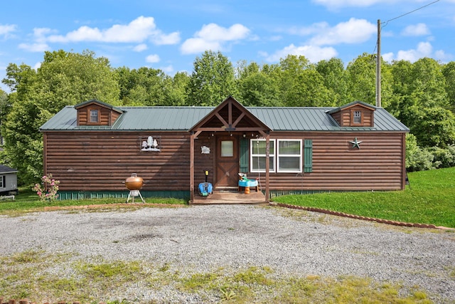 266 Boaters Aly, Nancy, KY 42544 - view of front of house featuring metal roof, faux log siding, and a front yard