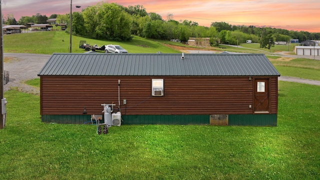 266 Boaters Aly, Nancy, KY 42544 - property exterior at dusk featuring log veneer siding, a yard, and metal roof