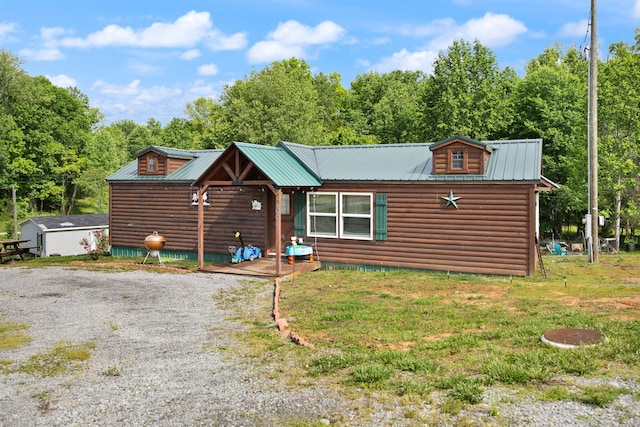 266 Boaters Aly, Nancy, KY 42544 - view of front of house featuring metal roof, a front lawn, driveway, and log veneer siding