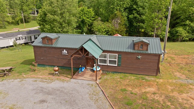 266 Boaters Aly, Nancy, KY 42544 - view of front of property with metal roof, a front lawn, and faux log siding
