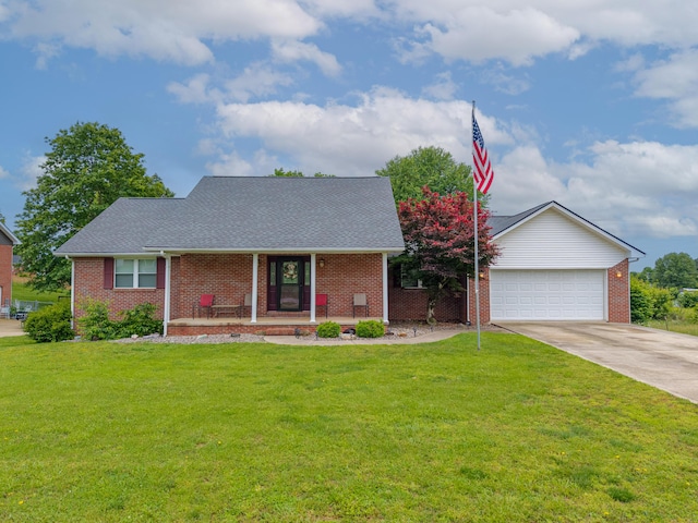 63 Harmons Way, Somerset, KY 42503 - view of front facade with covered porch, brick siding, driveway, and a front yard