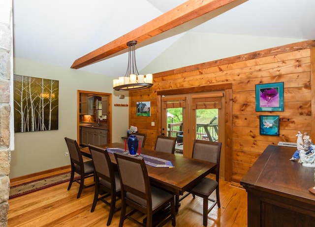 1220 Fox Wood Rd, Frankfort, KY 40601 - dining space with light wood-style floors, a chandelier, and wooden walls