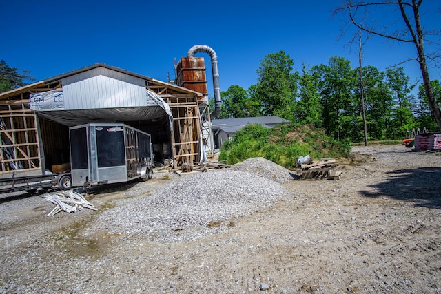 227 Callihan Rd, East Bernstadt, KY 40729 - back of property featuring a sunroom