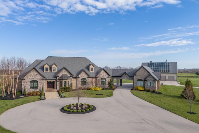 1782 W Leestown Rd, Midway, KY 40347 - french country inspired facade featuring curved driveway, stone siding, and a front yard