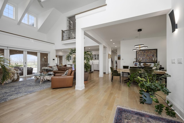 1782 W Leestown Rd, Midway, KY 40347 - living room featuring light wood-style flooring, a high ceiling, plenty of natural light, and french doors