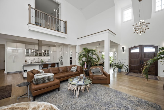 1782 W Leestown Rd, Midway, KY 40347 - living room featuring wood finished floors, a chandelier, and a high ceiling
