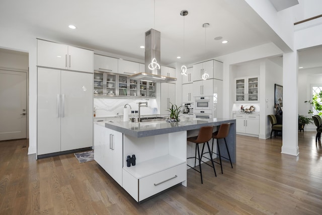 1782 W Leestown Rd, Midway, KY 40347 - kitchen featuring island range hood, glass insert cabinets, white cabinetry, dark wood-style flooring, and recessed lighting
