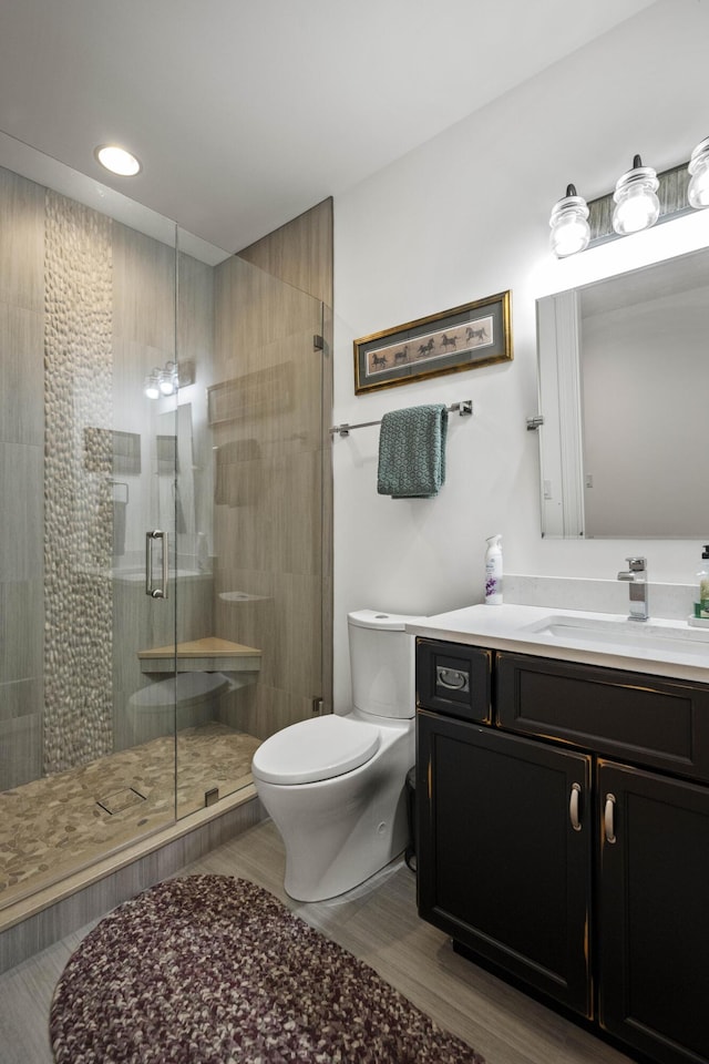 1782 W Leestown Rd, Midway, KY 40347 - bathroom with toilet, wood finished floors, a shower stall, vanity, and recessed lighting