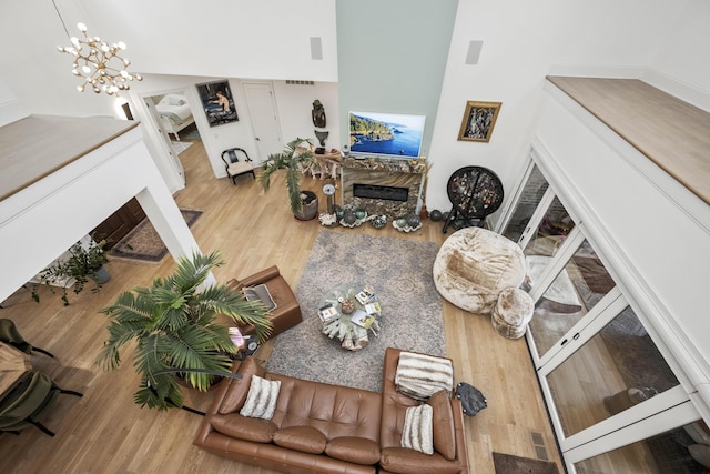 1782 W Leestown Rd, Midway, KY 40347 - living area with a fireplace, wood finished floors, and a chandelier