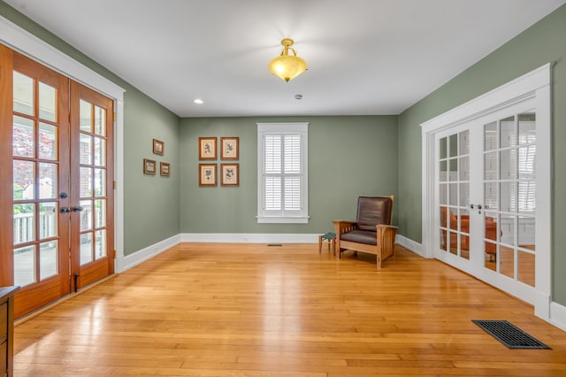 133 Victory Ave, Lexington, KY 40502 - living area featuring french doors, light wood-style floors, baseboards, and recessed lighting