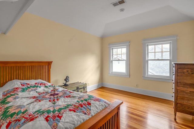 133 Victory Ave, Lexington, KY 40502 - bedroom with light wood-style flooring, lofted ceiling, and baseboards