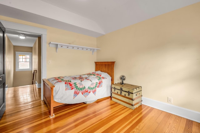 133 Victory Ave, Lexington, KY 40502 - bedroom featuring wood finished floors, baseboards, and lofted ceiling