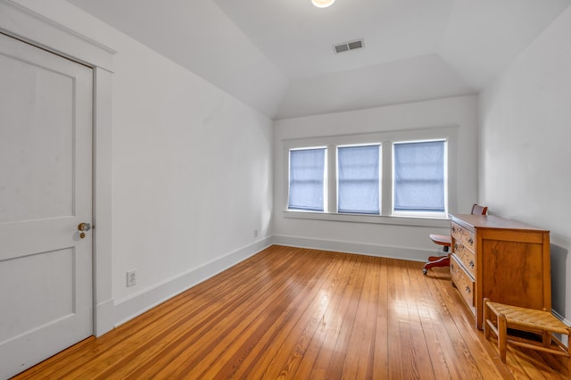 133 Victory Ave, Lexington, KY 40502 - unfurnished bedroom with light wood-style flooring, baseboards, and lofted ceiling