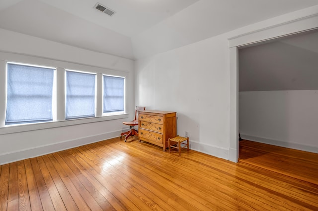 133 Victory Ave, Lexington, KY 40502 - unfurnished bedroom with lofted ceiling, light wood-type flooring, and baseboards