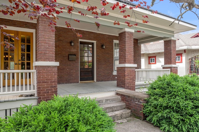 133 Victory Ave, Lexington, KY 40502 - view of exterior entry with french doors, a porch, and brick siding
