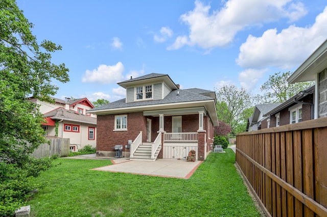 133 Victory Ave, Lexington, KY 40502 - rear view of property with brick siding, a patio, and a shingled roof