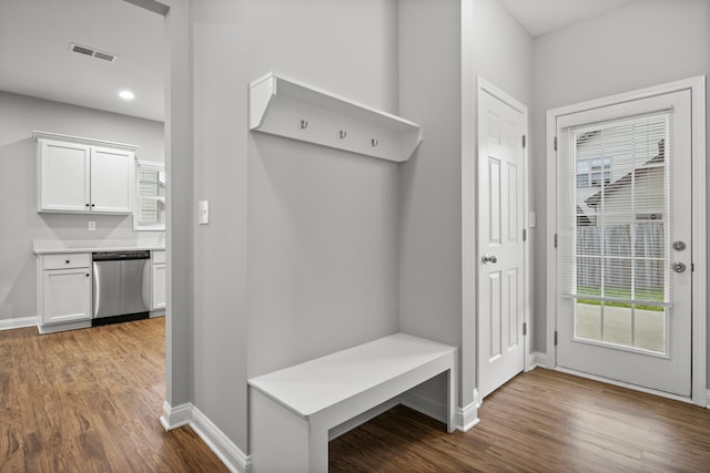 mudroom with dark wood-style flooring, baseboards, and recessed lighting