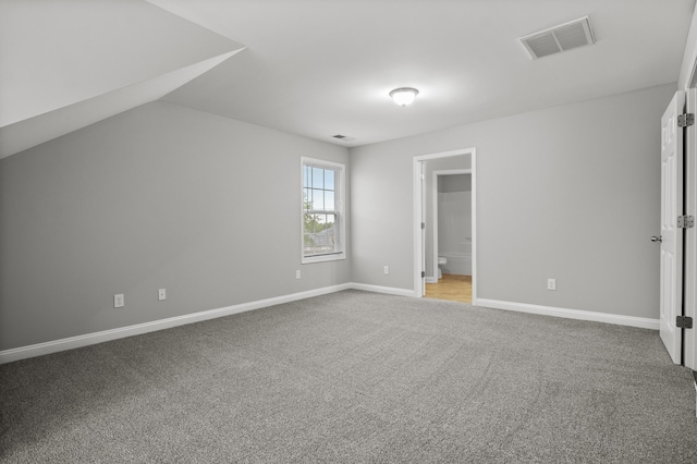 additional living space featuring carpet and baseboards