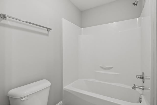 full bathroom with washtub / shower combination and toilet