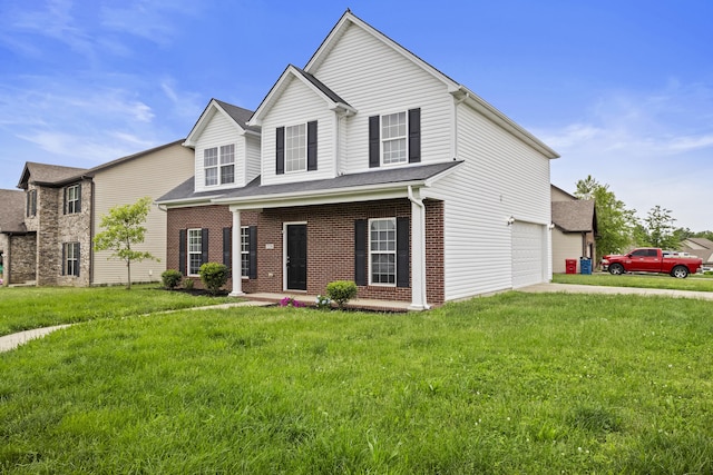 view of front of property with driveway, a front lawn, and brick siding