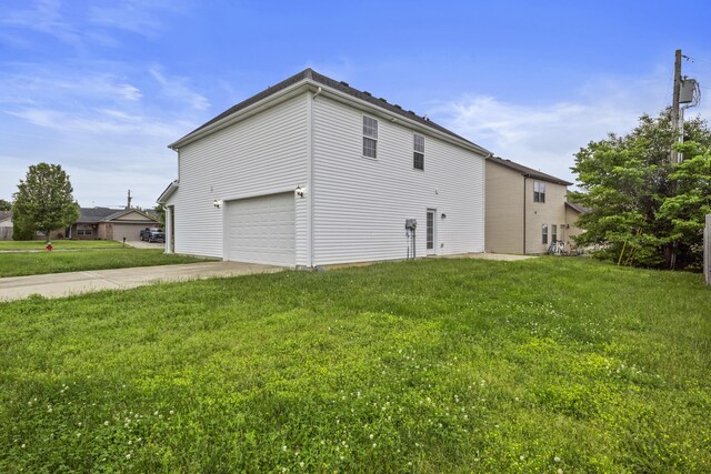 view of home's exterior with concrete driveway, a lawn, and a garage