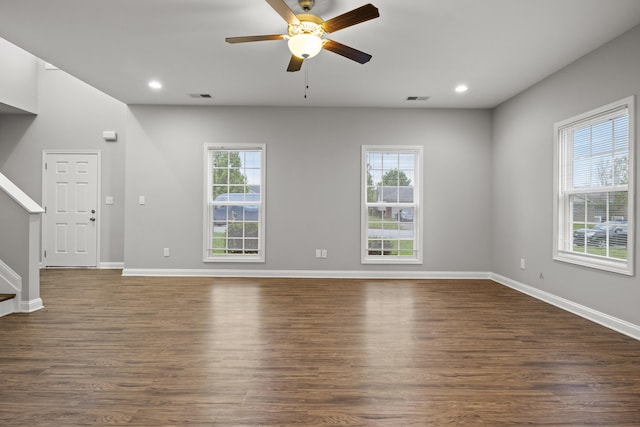 unfurnished living room with ceiling fan, dark wood finished floors, baseboards, and recessed lighting